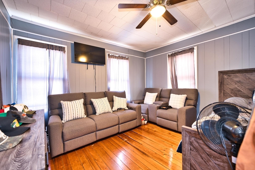 232 Alden Street Fall River, MA 02723 - Photo 15 of 34 a living room with furniture ceiling fan and a window