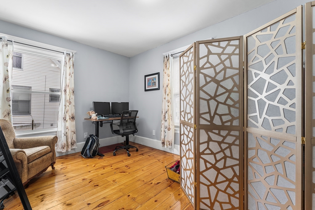 322 Highland Street Worcester, MA 01602 - Photo 18 of 29 a workspace with furniture and a window