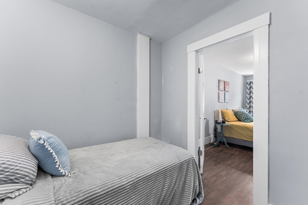 322 Highland Street Worcester, MA 01602 - Photo 24 of 32 a bedroom with a bed and a view of bedroom