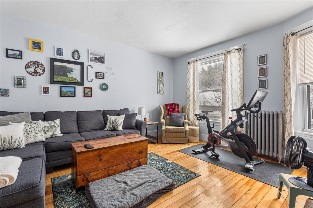 322 Highland Street Worcester, MA 01602 - Photo 3 of 32 a living room with furniture rug and a window