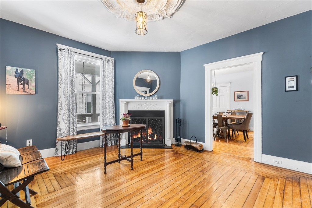 322 Highland Street Worcester, MA 01602 - Photo 3 of 29 a living room with furniture and a fireplace