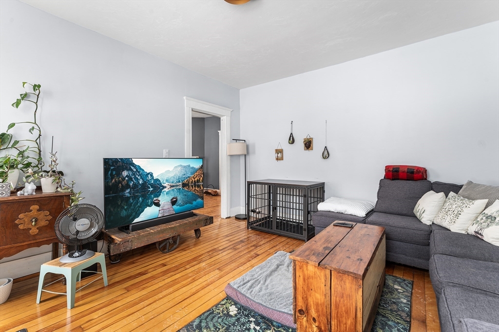 322 Highland Street Worcester, MA 01602 - Photo 5 of 29 a living room with furniture and a flat screen tv