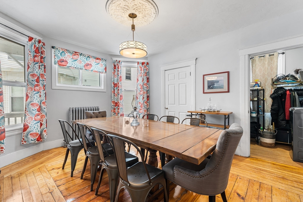 322 Highland Street Worcester, MA 01602 - Photo 5 of 32 a view of a dining room with furniture wooden floor and chandelier
