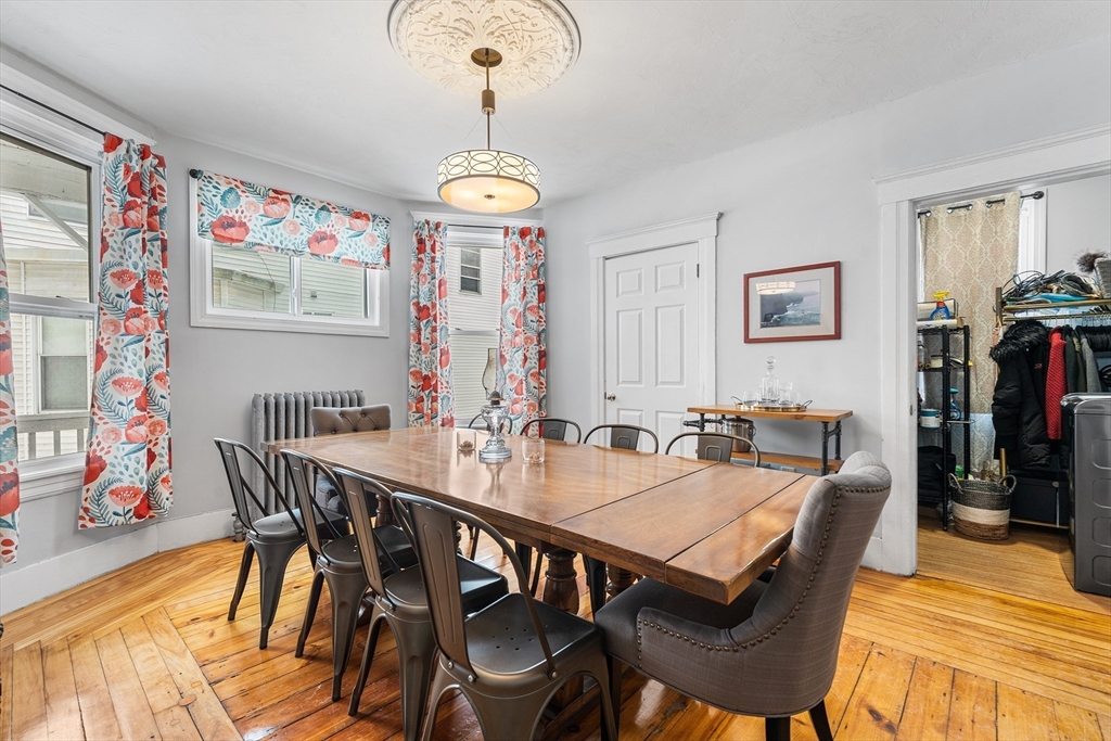 322 Highland Street Worcester, MA 01602 - Photo 6 of 29 a view of a dining room with furniture wooden floor and chandelier