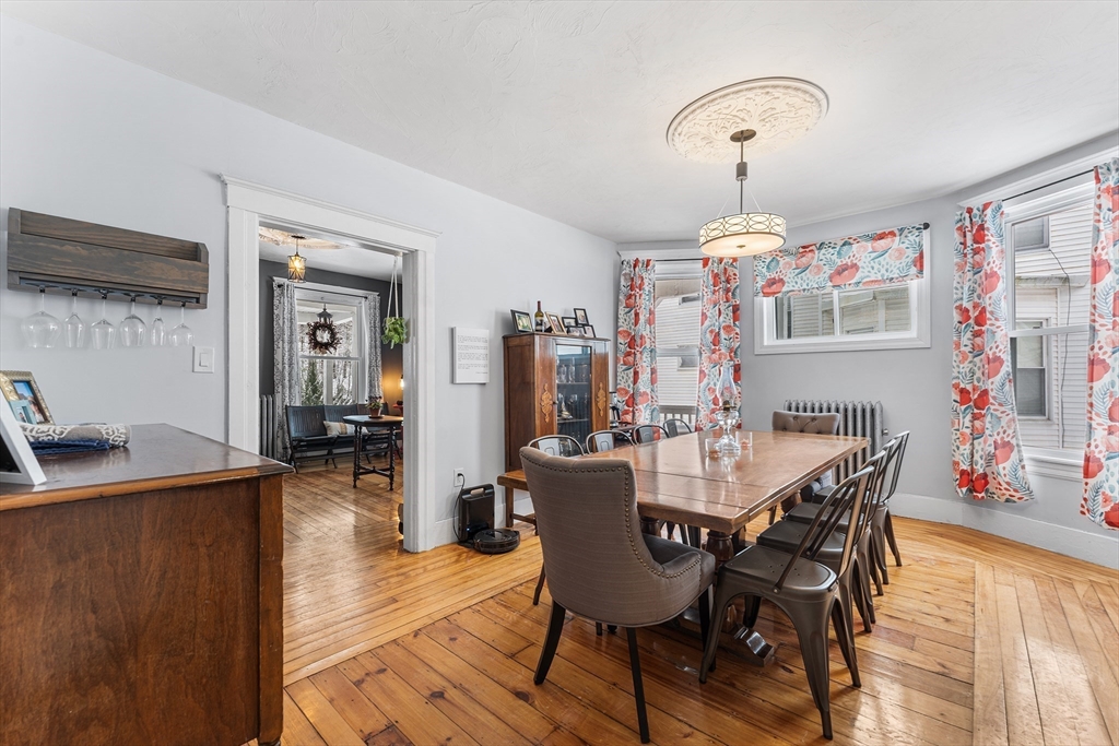 322 Highland Street Worcester, MA 01602 - Photo 7 of 29 a view of a dining room with furniture and wooden floor