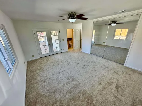 a view of an empty room with a window