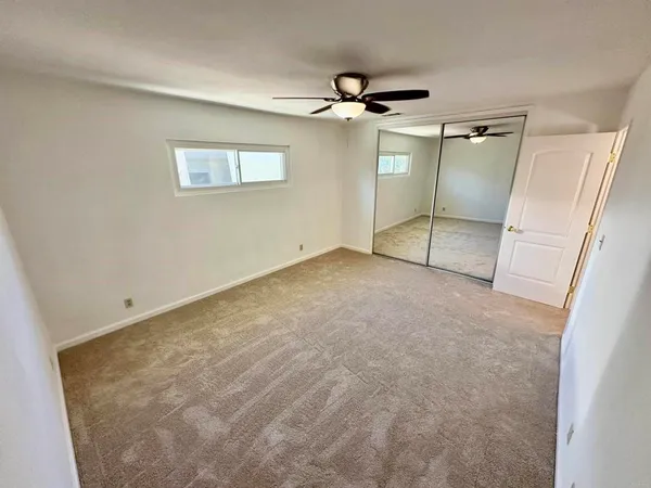a bathroom with a sink toilet a mirror and shower