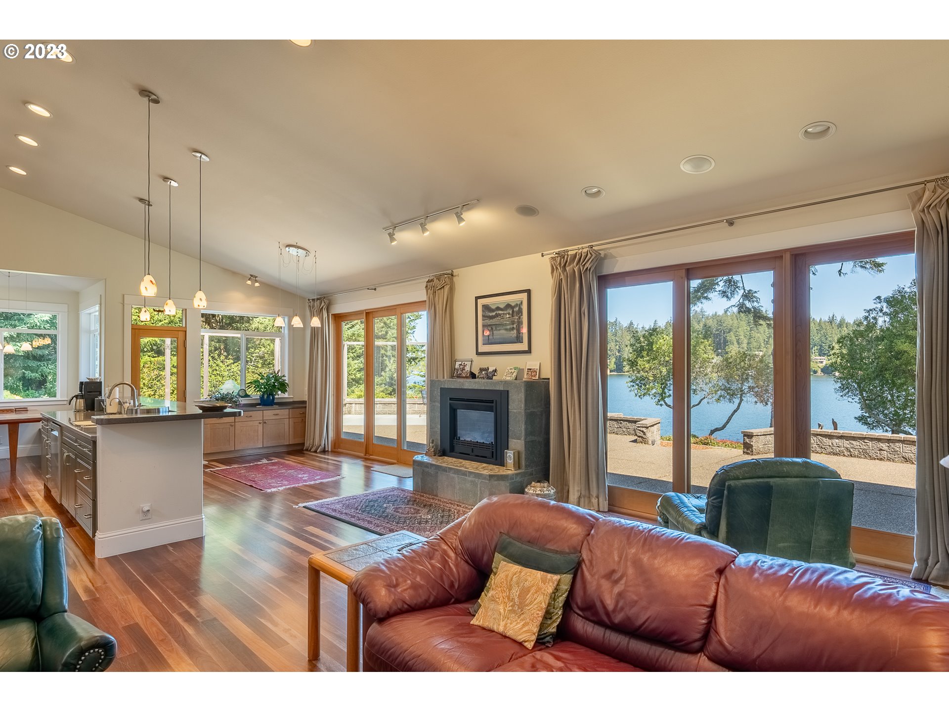 83917 Cloud 9 Road Florence, OR 97439 - Photo 11 of 48 a living room with furniture fireplace and large windows