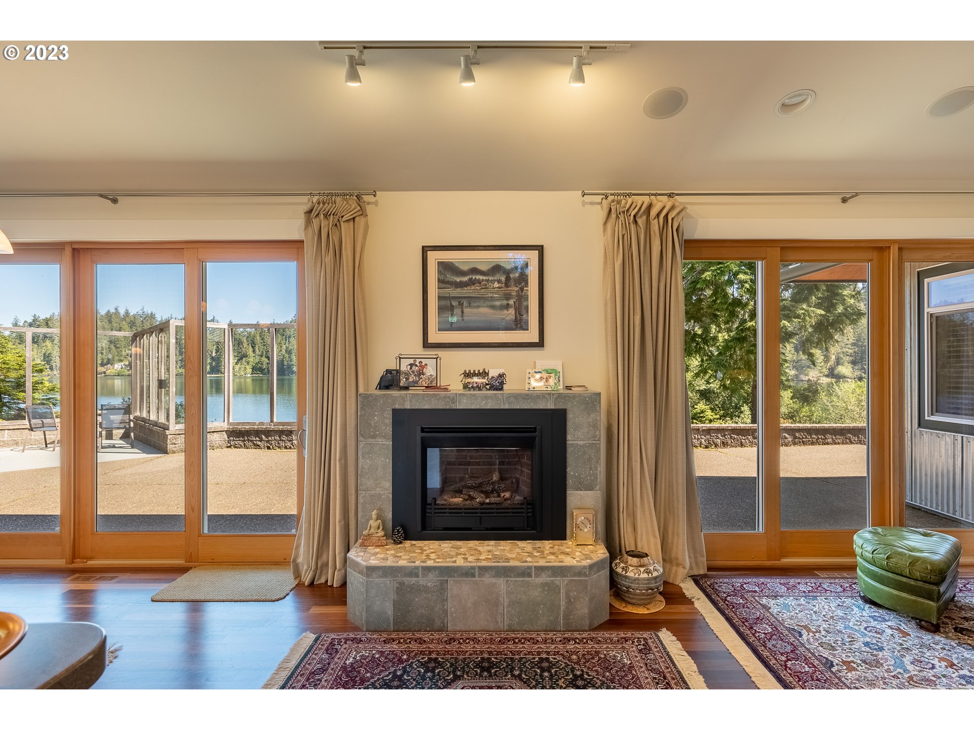 83917 Cloud 9 Road Florence, OR 97439 - Photo 12 of 48 a living room with furniture a large window and a fireplace