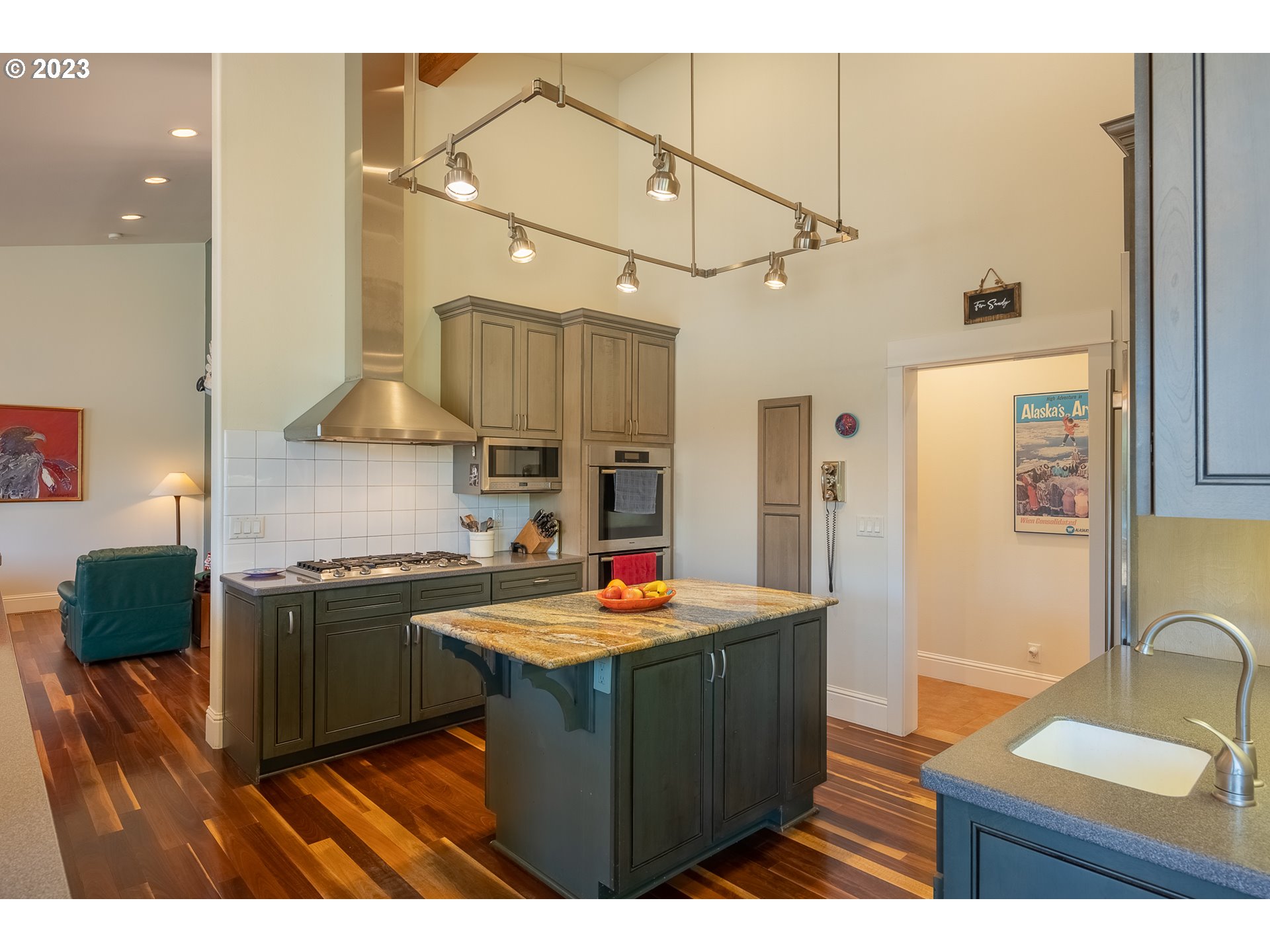 83917 Cloud 9 Road Florence, OR 97439 - Photo 16 of 48 a kitchen with stainless steel appliances granite countertop a sink stove and refrigerator