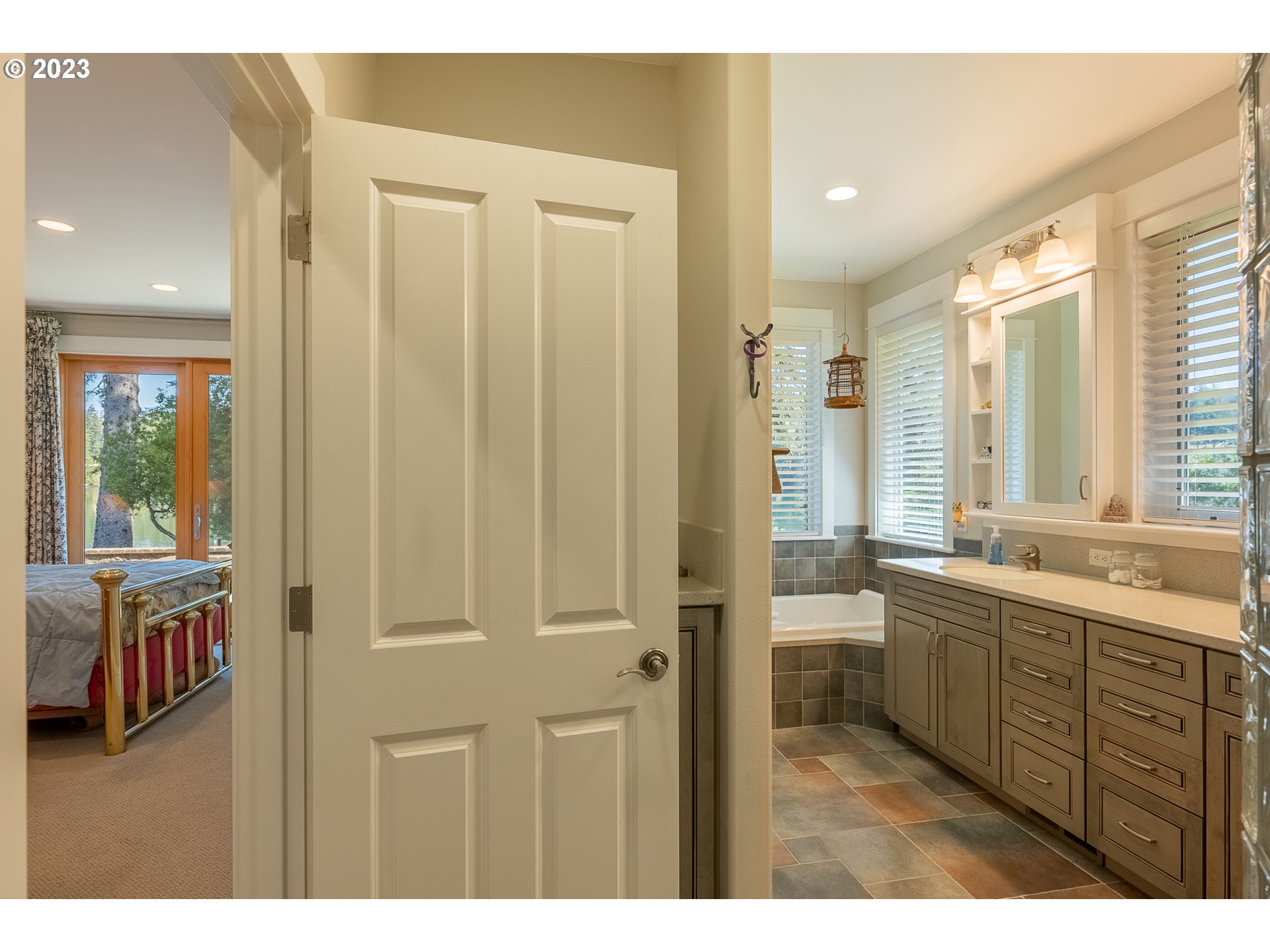 83917 Cloud 9 Road Florence, OR 97439 - Photo 24 of 48 a bathroom with a double vanity sink and a mirror