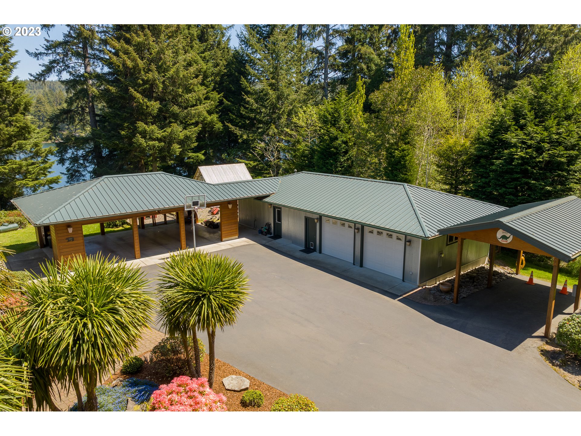 83917 Cloud 9 Road Florence, OR 97439 - Photo 38 of 48 a view of a house with roof deck outdoor seating area and furniture