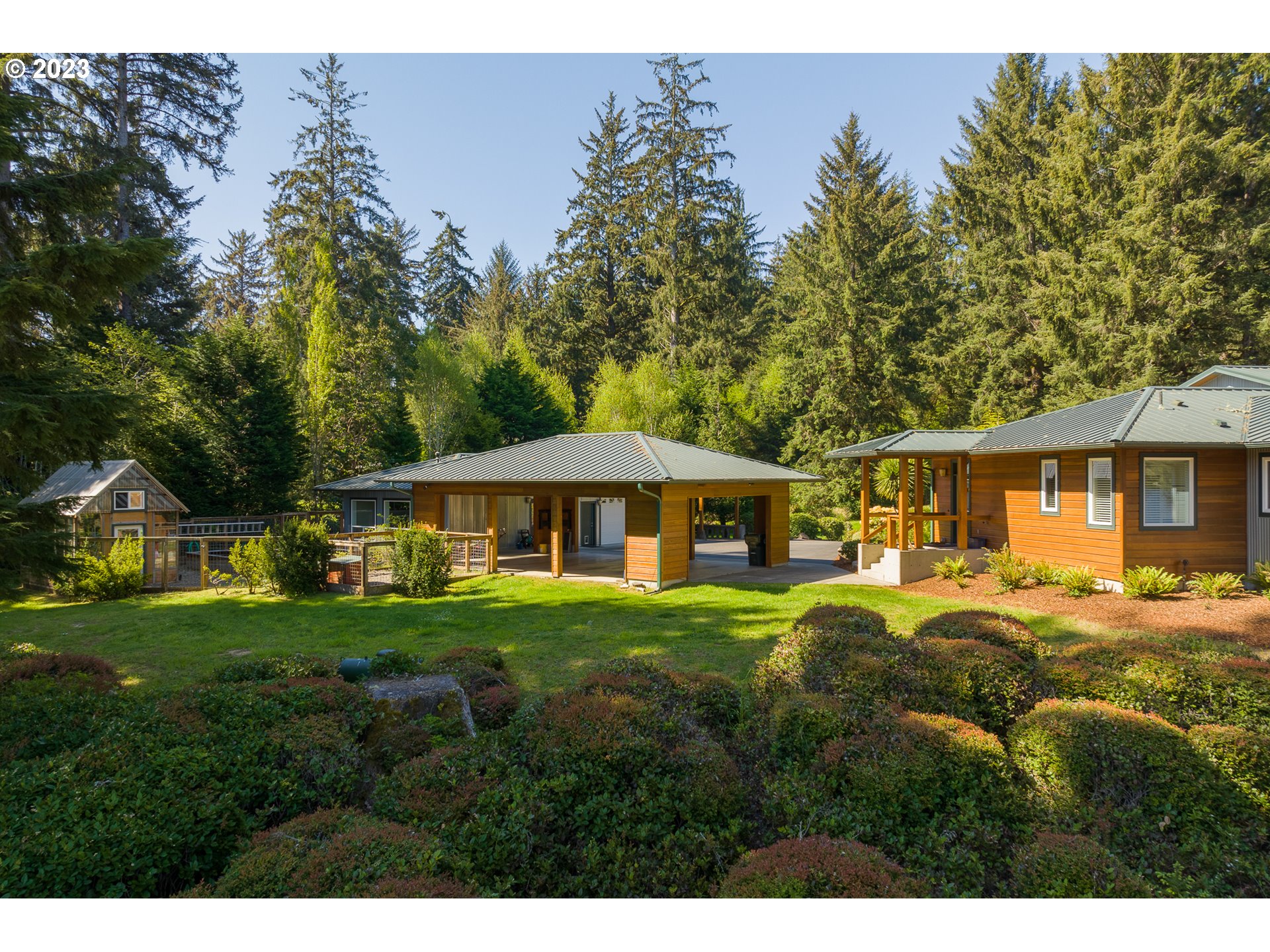 83917 Cloud 9 Road Florence, OR 97439 - Photo 41 of 48 a front view of a house with a garden