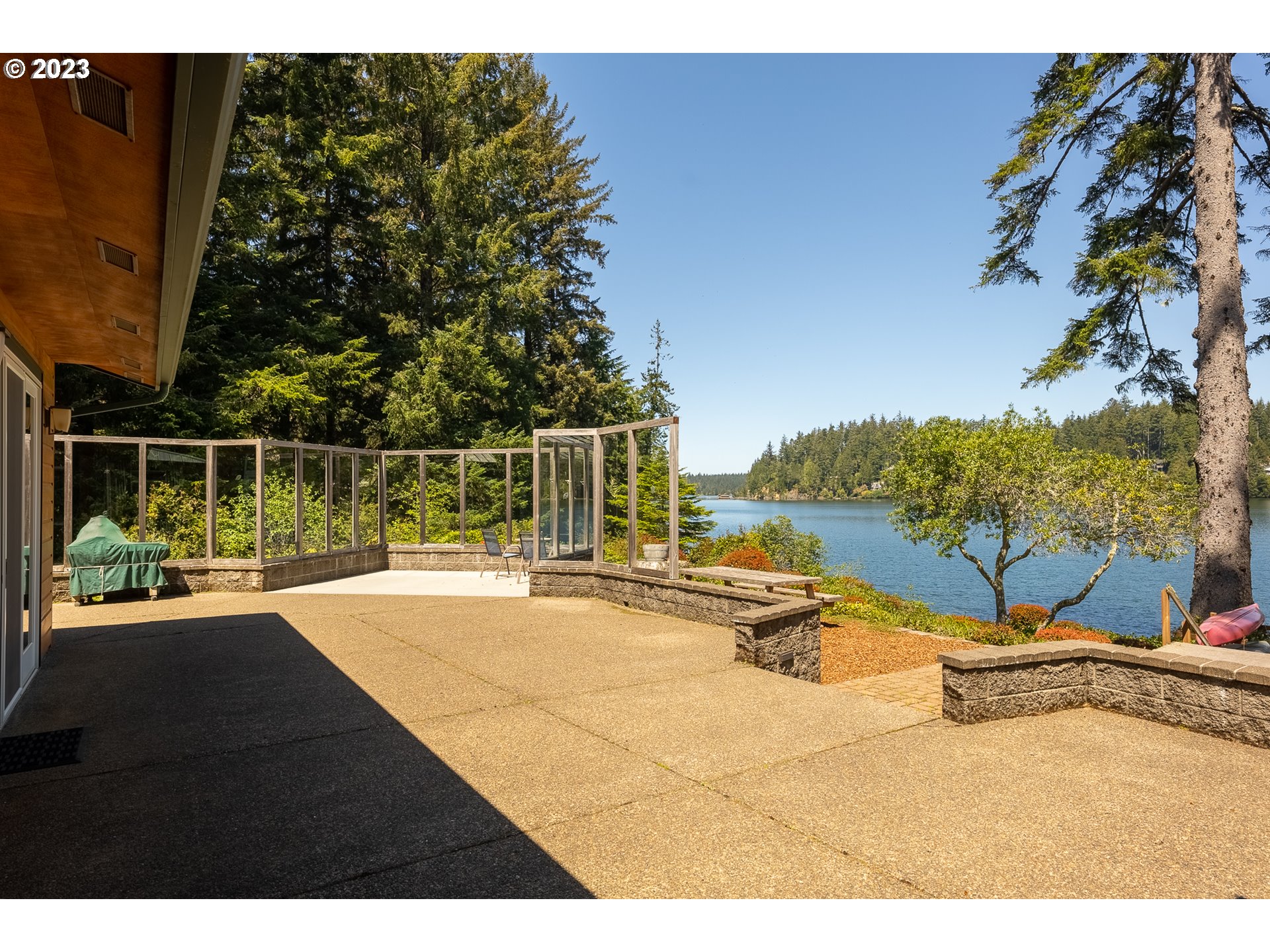 83917 Cloud 9 Road Florence, OR 97439 - Photo 44 of 48 a view of a swimming pool with a patio and a garden