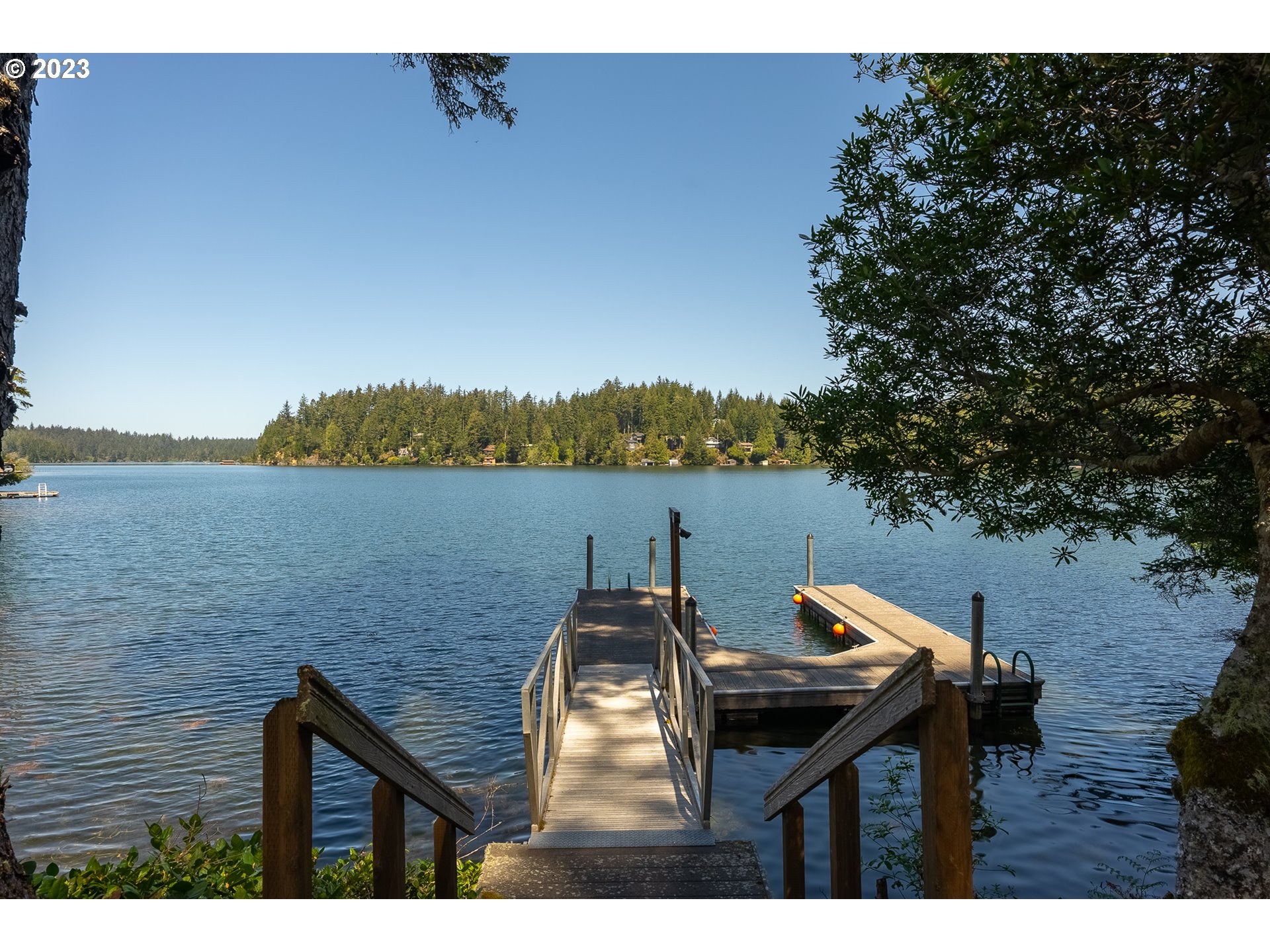83917 Cloud 9 Road Florence, OR 97439 - Photo 47 of 48 a backyard of a house with table and chairs