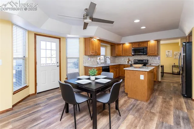 a view of a dining room with furniture window and wooden floor
