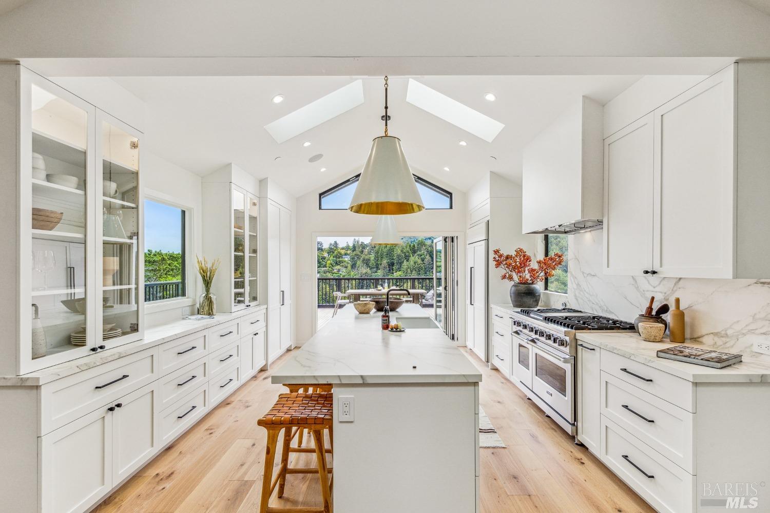 99 Hillside Avenue Mill Valley, CA 94941 - Photo 1 of 1 a kitchen with granite countertop a stove and a sink