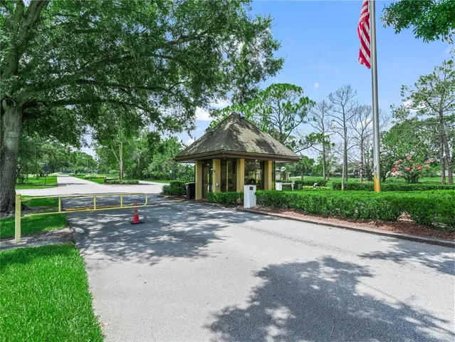 a view of a backyard with sitting area