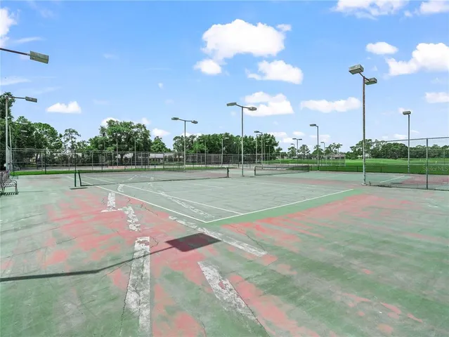 a view of a porch with a table and chairs