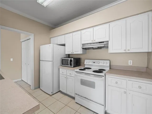 a view of a livingroom with a ceiling fan and window