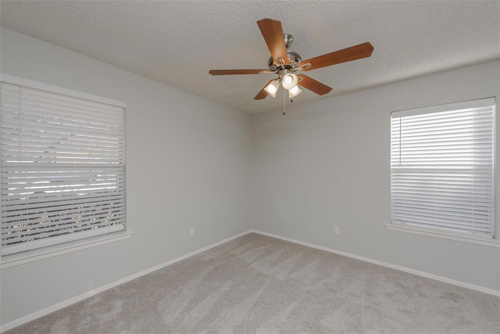 3609 Cooper Branch East Denton, TX 76209 - Photo 12 of 23 an empty room with a window and a fan