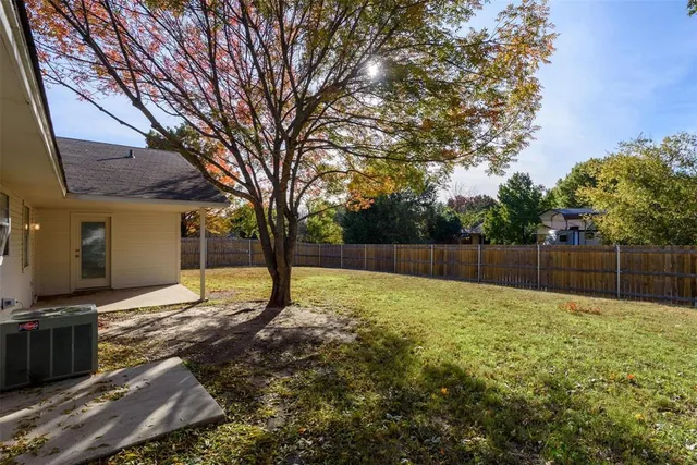 a swimming pool with wooden fence