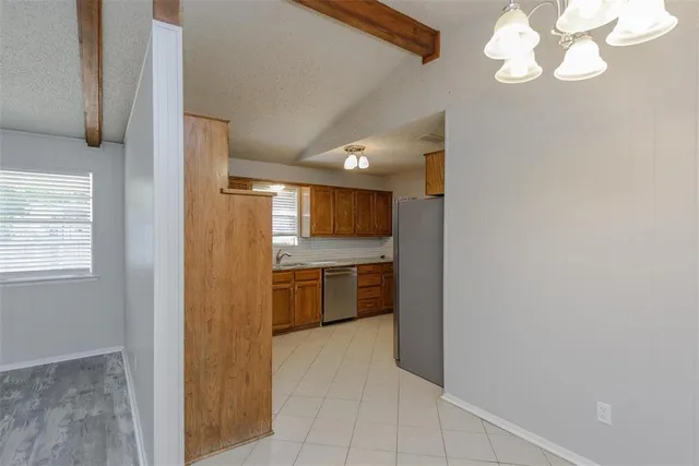 a view of a kitchen with a sink and dishwasher kitchen view