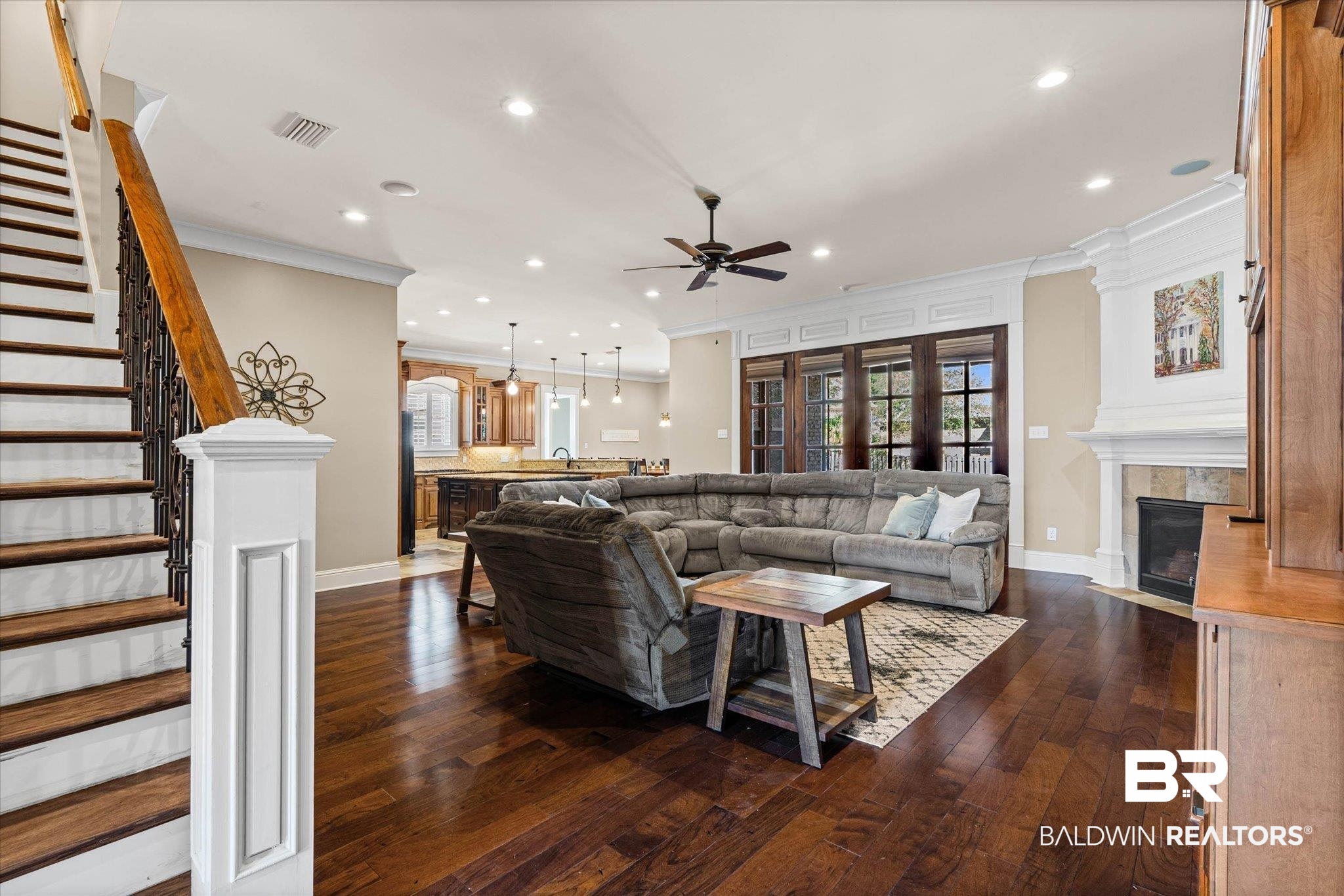 7676 Rockstone Lane Mobile, AL 36695 - Photo 8 of 47 Living room featuring dark wood finished floors, ceiling fan, a tiled fireplace, recessed lighting, and plenty of natural light
