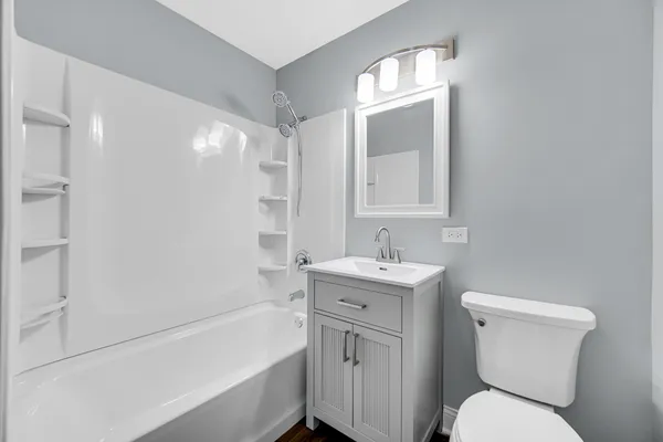a bathroom with a toilet sink and bathtub