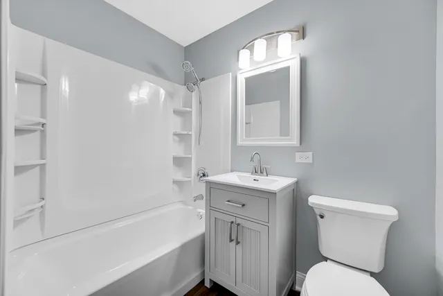 a bathroom with a toilet sink and bathtub