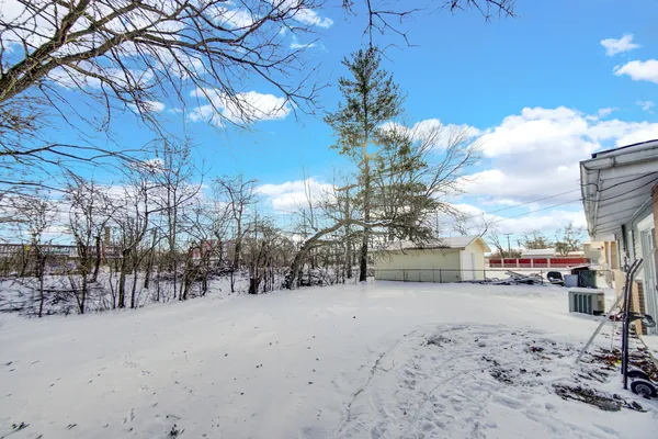 a view of a road with a building in the background