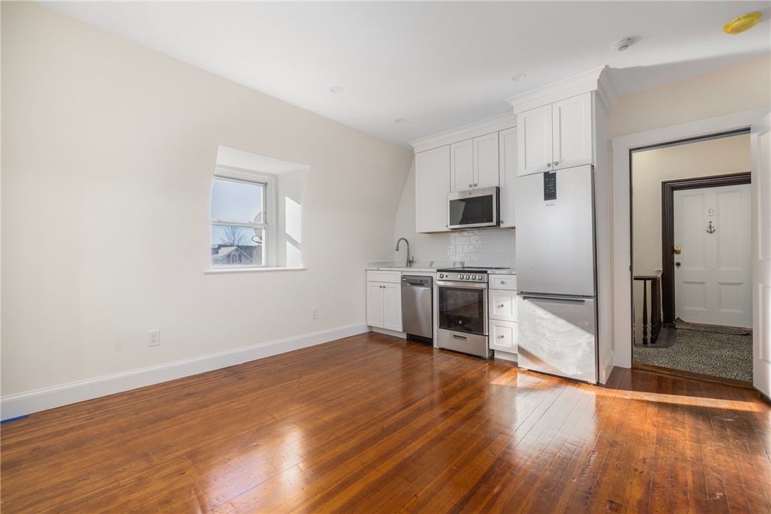 67 Perry Street, Unit 7 Newport, RI 02840 - Photo 7 of 27 Open concept includes the kitchen, dining, and living area.