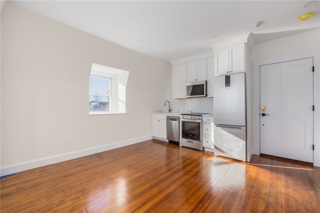 67 Perry Street, Unit 7 Newport, RI 02840 - Photo 8 of 27 Refurbished original hardwood floors.