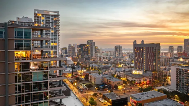 a dining room with furniture and a chandelier
