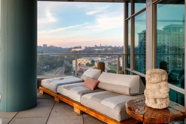 a outdoor living room with patio furniture