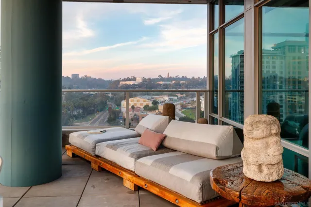 a outdoor living room with patio furniture