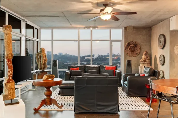 a living room with furniture and a large window