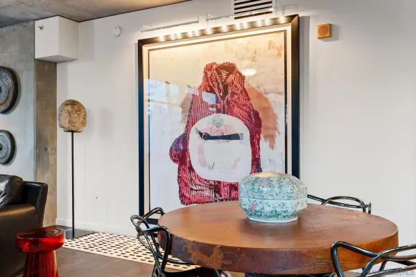 a dining room with furniture and wooden floor