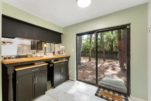 a kitchen with a sink and large window