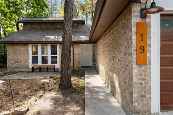 a front view of a house with parking area