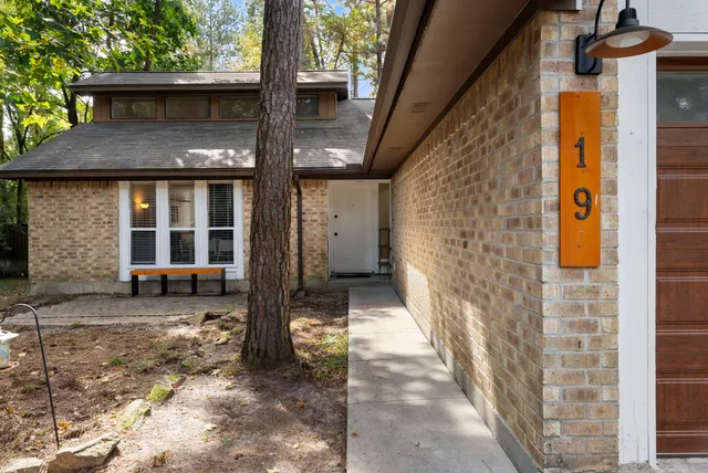 a front view of a house with parking area