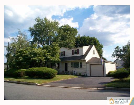 5 Rodney Road East Brunswick, NJ 08816 - Photo 1 of 8 a front view of a house with a yard