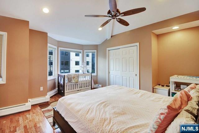 176 Undercliff Avenue Edgewater, NJ 07020 - Photo 11 of 22 a bedroom with a large bed and a window