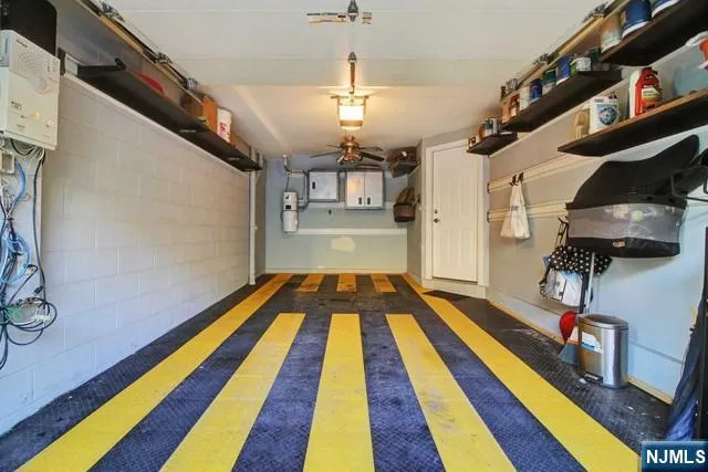 a very nice looking room with a rug and a chandelier