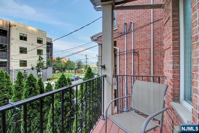 176 Undercliff Avenue Edgewater, NJ 07020 - Photo 21 of 22 a view of a chair and table in the balcony