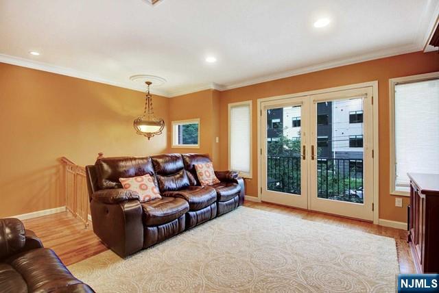 176 Undercliff Avenue Edgewater, NJ 07020 - Photo 4 of 22 a living room with furniture and a large window