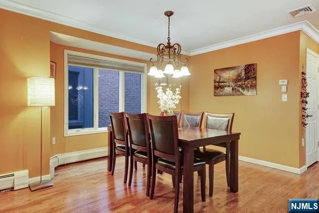 a view of a dining room with furniture and window
