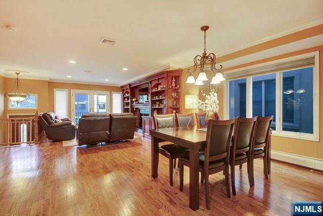 176 Undercliff Avenue Edgewater, NJ 07020 - Photo 6 of 22 a view of a dining room with furniture window and wooden floor