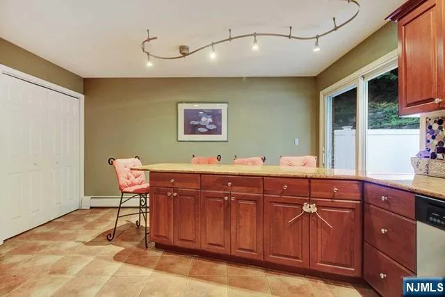a spacious bathroom with a sink and a mirror