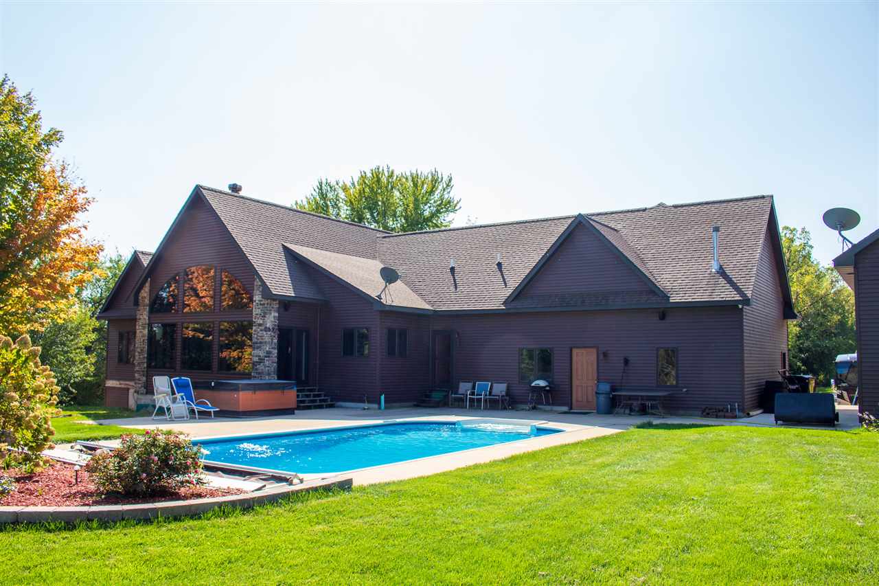 600 Palmyra Road Dixon, IL 61021 - Photo 3 of 40 a view of a house with a yard and swimming pool